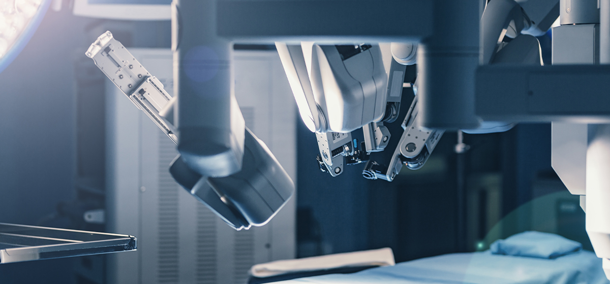 Surgical robotic arms in operating room.